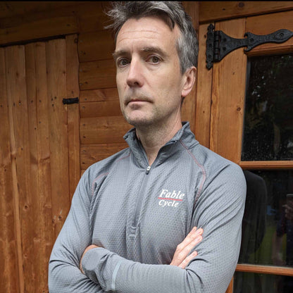 Fablecycle long-sleeve zip-up cycling top: arms folded